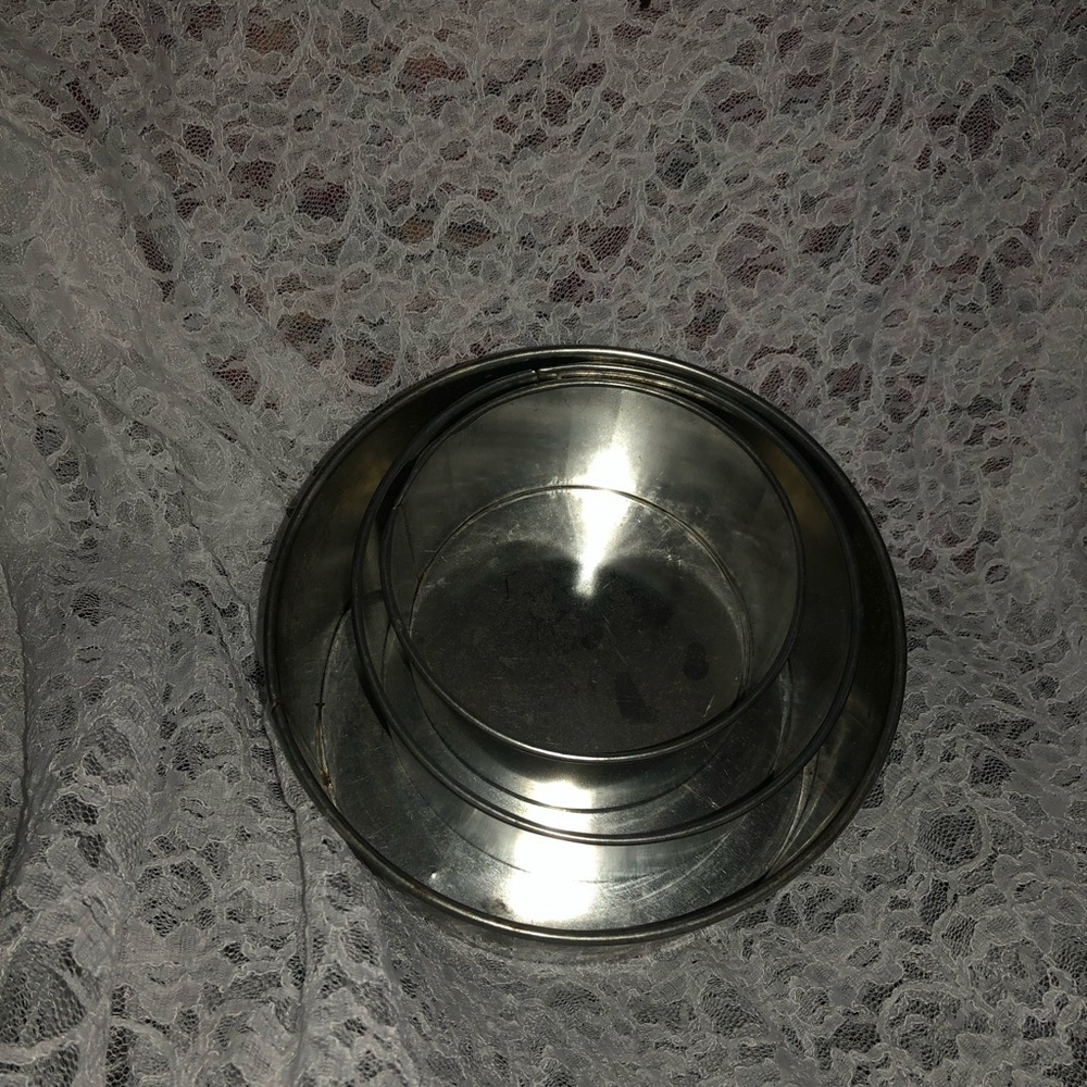 A set of three fruitcake/ wedding cake baking pans. Non removable bottoms